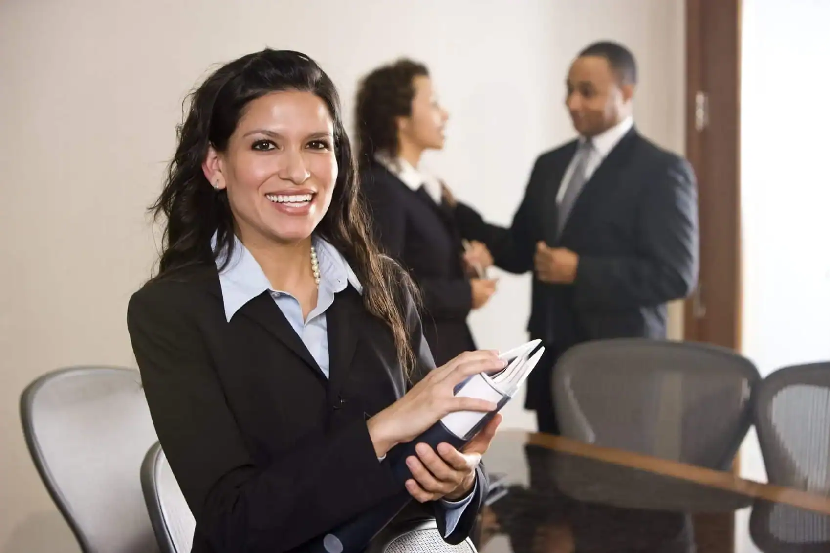 businesswoman in suite smiling
