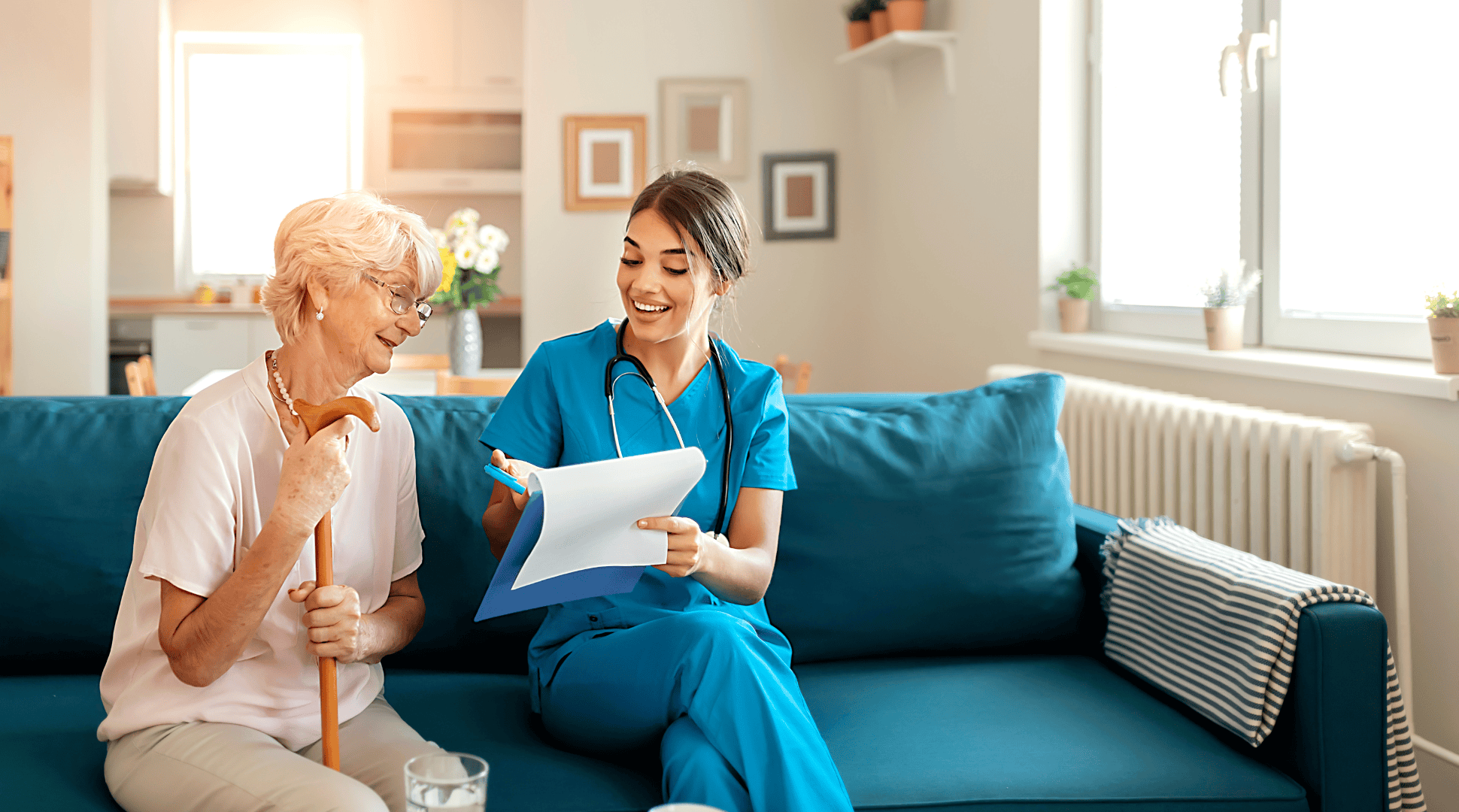 Healthcare worker consulting with elderly patient at home