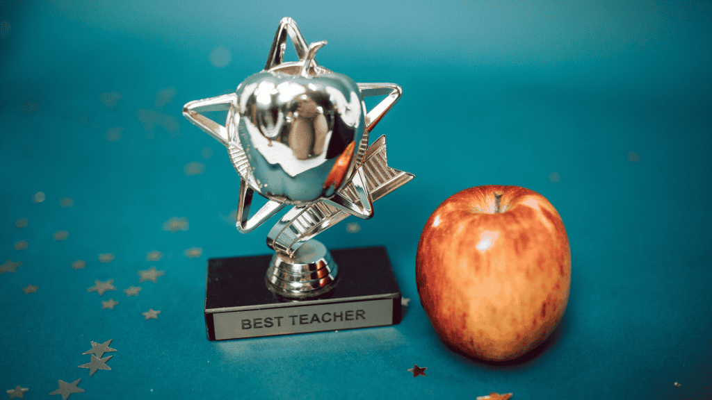 Teacher of the Year Award 2025|Teacher of the year award|APSA Teacher of the Year award plaque held by a woman