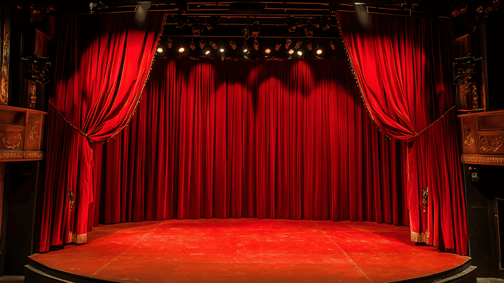 Stage performance with red velvet curtains
