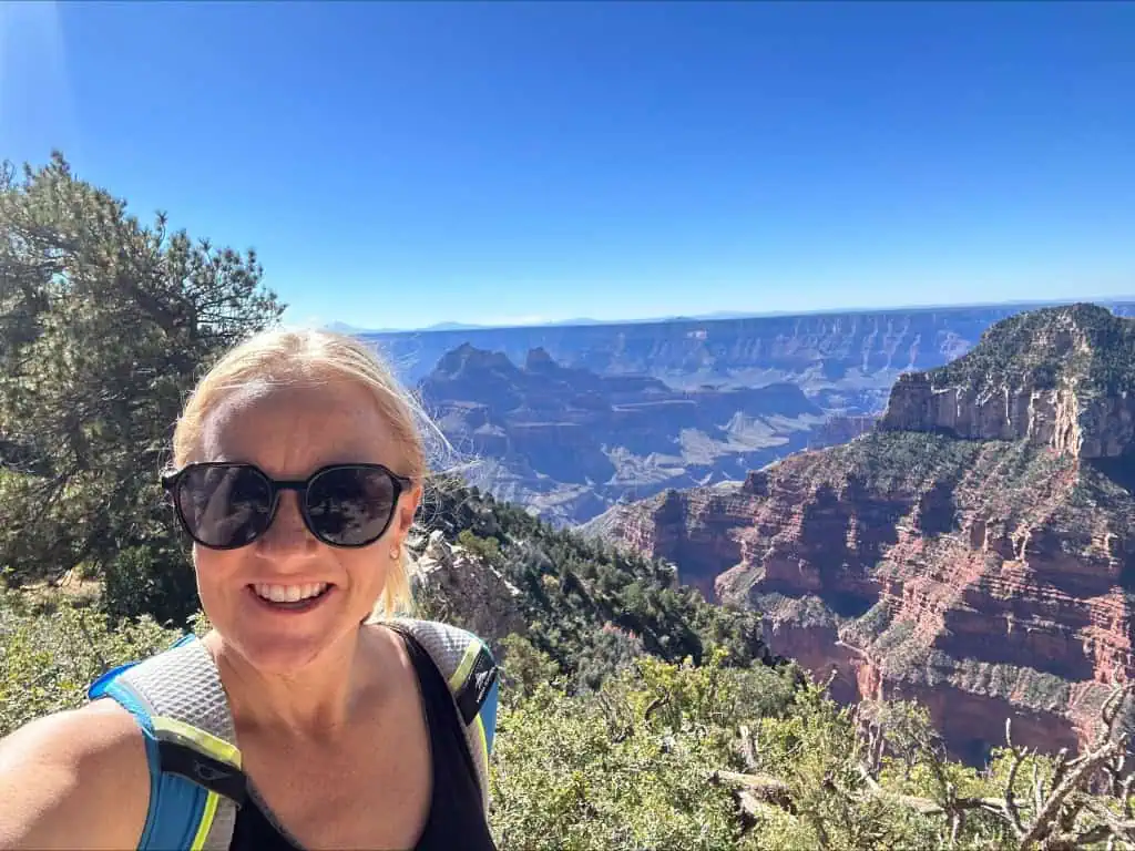 A woman taking a selfie in front of an Arizona landscape