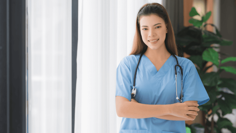 A woman in scrubs with a stethoscope