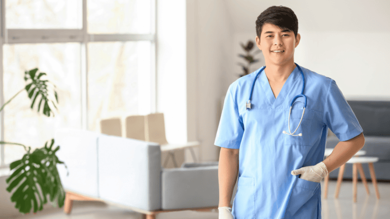 A person in scrubs standing in the middle of a room