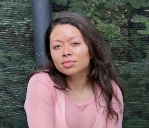 Nadya Sanchez, AA in fitness graduate 6 A woman sitting