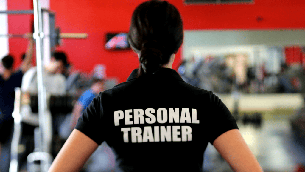 BU Fitness Graduate Claire Cielinski 1 a person wearing a black shirt with the word personal trainer on it