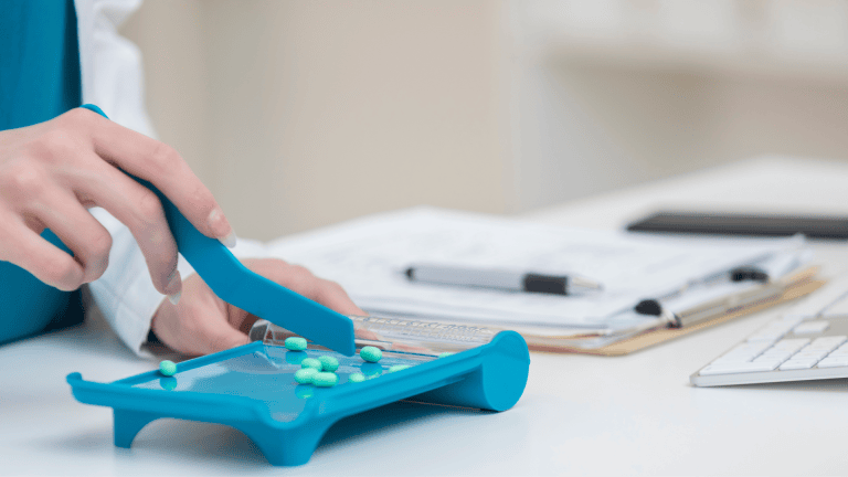 a person is using an electronic device on a table