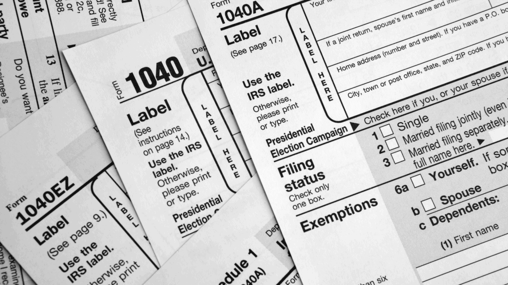 a pile of tax forms is shown in black and white