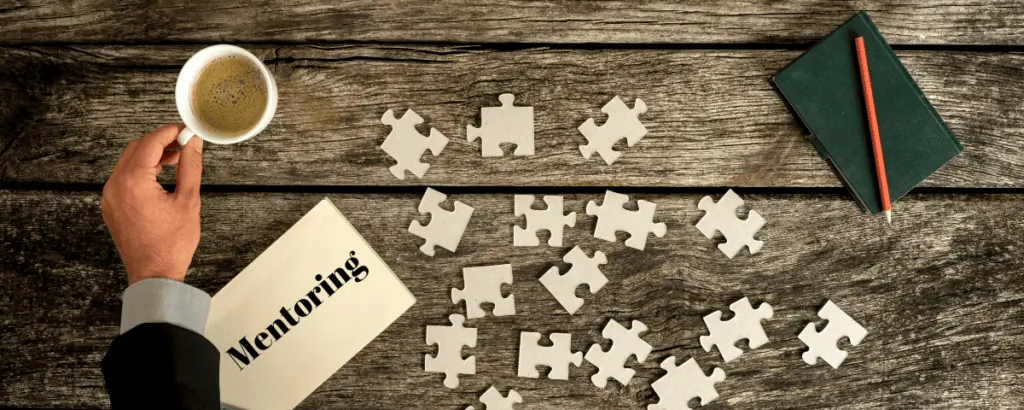 desk with coffee and puzzle pieces