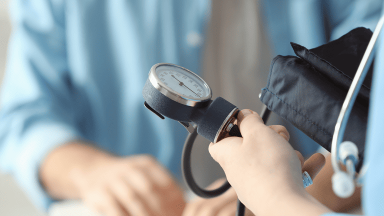 photo of medical assistant taking blood pressure